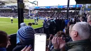 BRISTOL ROVERS PLAYERS AND FANS CELEBRATE SCOTT SINCLAIRS WINNING GOAL AGAINST PETERBOROUGH.