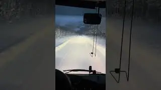 Driving in the countryside outside of Tromso during heavy snowfall in December