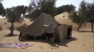 Putting up the Bedu tent at the base of the Arabian desert expedition