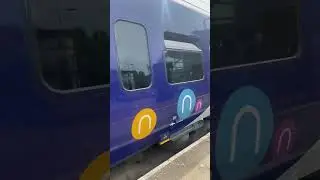 Northern- (323242) departing St Helens central with a wave from the guard