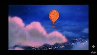 A hot air balloon is flying away 