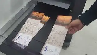 Duplo DC 618 Multifinisher (Slitter/ Cutter/ Creaser) processing SRA3 laminated paper to a Wine Menu