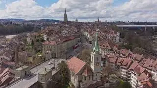 Aerial view of Bern, Switzerland, highlighting the historic Nydegg Church, Nydeggbrucke and its