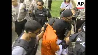 Suspects arrive at police HQ in capital for questioning, AP pix