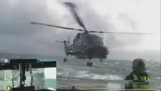 Lynx Helicopter landing on ship in rough sea