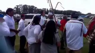 Walkers entering the arbor to the powwow area