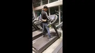 Guy Falls off Treadmill and Loses His Glasses Attempting a Dare at the Gym
