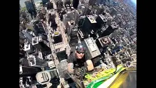 Climbing the Chrysler Building spire.