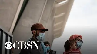 U.S.-bound Afghan evacuation flights temporarily halted over measles concern