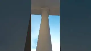 In front of the huge pillar