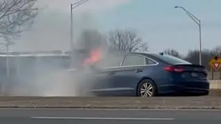 Firefighters extinguish car fire 