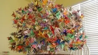 Construction of 1000 origami folding paper cranes on a wired tree