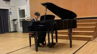 Max plays piano at Royal Latin School