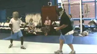 Coach Miller and Joe Pipkin take a lesson