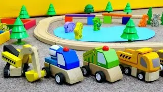 Spielzeugautos bauen einen Tierpark. Trickfilm für Kleinkinder.