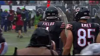 Chicago bears celebrate winning by sliding in the water on field !