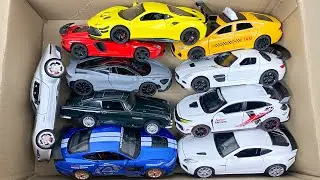Box Full of Model Cars -Tesla Robotaxi, Tesla Cybertruck, Tesla Roadster, Lexus LC500, Lexus Lm 300h