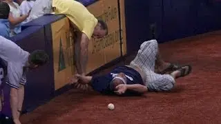 NYY@TB: Fan falls onto the field for a foul ball