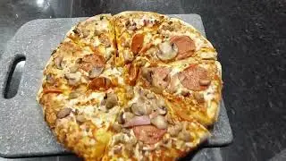 Mushroom Pepperoni ham pizza with Coca Cola.