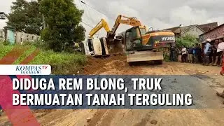 Diduga Rem Blong, Truk Bermuatan Tanah Terguling