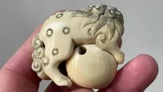 Stunning ivory Netsuke with a Shishi on Tama.