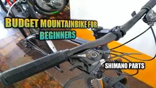 BUDGET MOUNTAINBIKE FOR BEGINNERS with SHIMANO PARTS & FREEBIES | BikerTeeezy BV