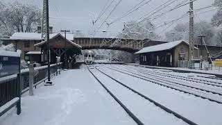 SEPTA train approaching Overbrook train station during a snowstorm 