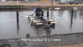 Muddring i Norje sm&aring;b&aring;tshamn med Truxor