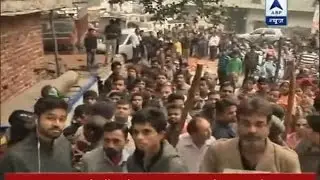 Long queue outside bank to deposit and withdraw money