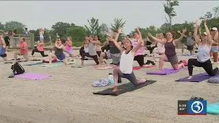 Video: Fitness club holds free yoga classes on the beach for 'International Yoga Day'