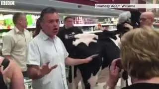 Farmers stage cow protest in Asda over milk prices