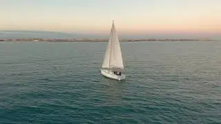 videoblocks aerial view the yacht sails on the sea at sunset drone flies around the yacht with sails