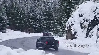 curve on a snowy forest road 4k