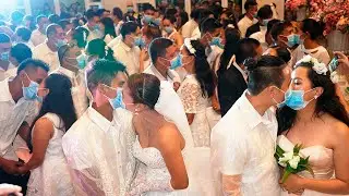 Coronavirus: Couples wear face masks at mass wedding in Philippines