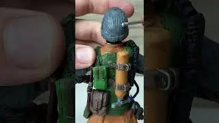 modeling a knitted hat for Anna's figurine