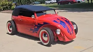 Classic cars leaving car show 