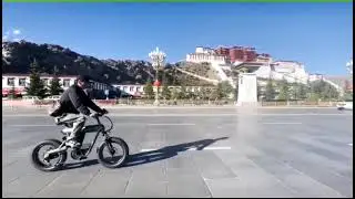 Riding on Coswheel T20 in front of the Potala Palace in Tibet