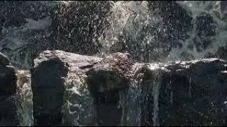 Multi-step waterfall, shallow trickle of water through rocks, sound effect free for use