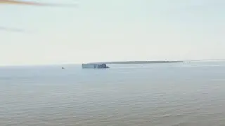 Drone video of overturned cargo ship at St. Simons Sound; Four crew members missing
