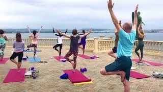 Tree pose yoga class with Yoga Escapes in Sicily Italy.