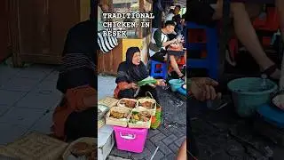 The Smile of Ngasem: Traditional Javanese Chicken Vendor at the Historic Market