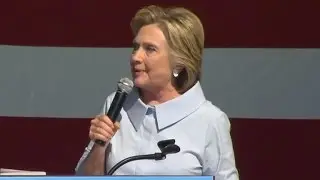 Clinton talks to press on campaign jet about foundation, Trump