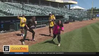 Ashley accidentally hits Gras with baseball while dancing with Savannah Bananas