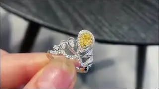 0.18 Cts Fancy Yellow Diamond Ring in Pear Shape Gemstone 0.63 Cts diamonds 18k Gold Wt. 3.89 Gms