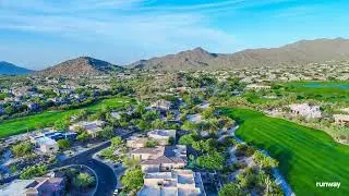An aerial drone video of a Mesa Arizona residential neighborhood at sunset Slow forward