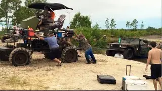 Hummer gets pulled out of deep pond by swamp buggy