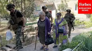 Ukrainian Police Group And NGO Workers Evacuate Civilians From Dobropilia
