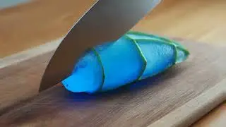 hailuo 2 3 macro shot of an alien fruit lying on a wooden cutting board a metal kitchen kni 0