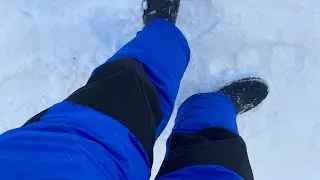 Walking in one piece snowsuit ski suit in the snow