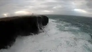 Huge wave breaks over lighthouse Eshaness, Shetland